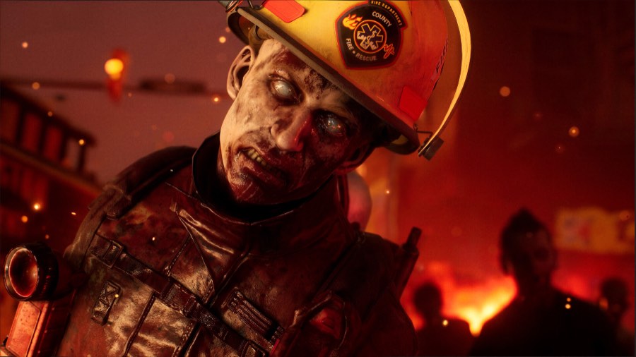 Close-up of an infected firefighter still wearing a helmet, lit red